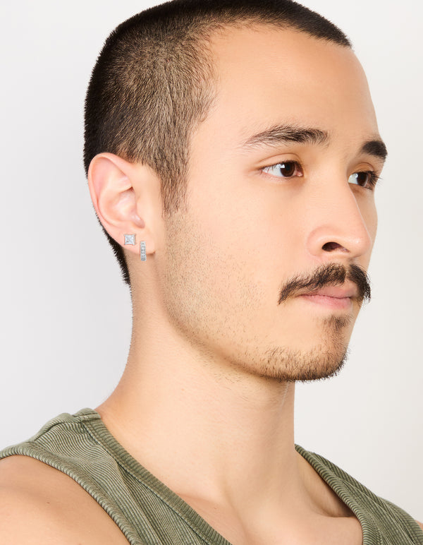 Designed with mens waterproof stainless steel square cubic zirconia and huggie earrings in a 2-pack with crystal accents, hoop closures, and silver tone on model view