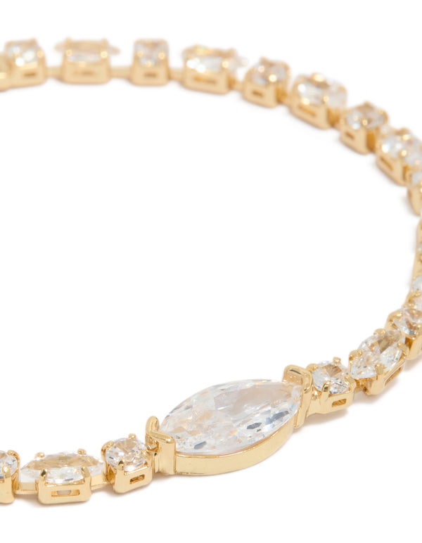 Showcasing a gold plated chunky tennis bracelet with cubic zirconia in dainty styling close up view