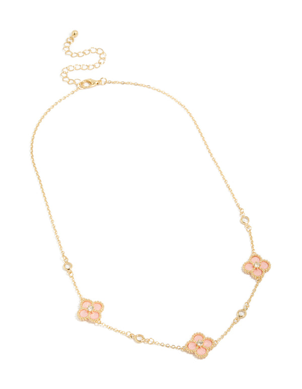 Detailed view of gold plated pink cubic zirconia flower trio necklace with floral and clasp in statement style front view