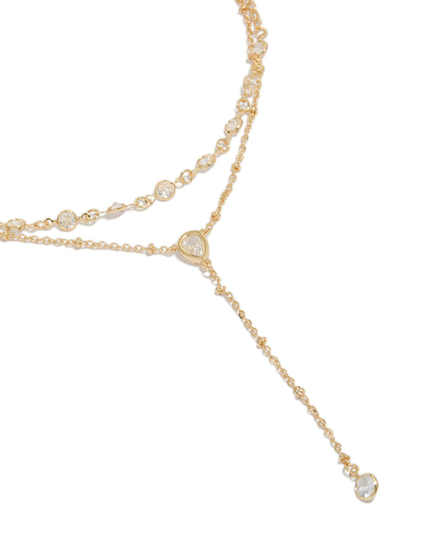 Showcasing a cubic zirconia teardrop bezel Y-necklace with beads in gold plated close up view