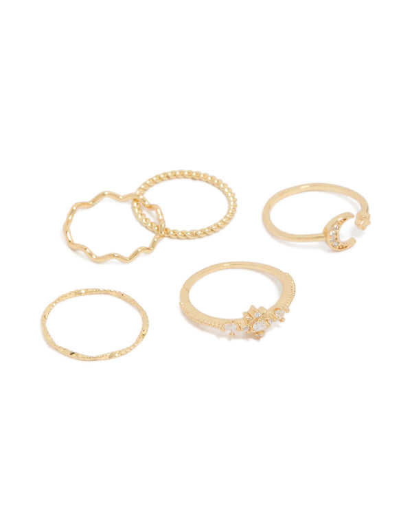 Showcasing celestial cubic zirconia gold plated statement rings featuring star and moon designs front view