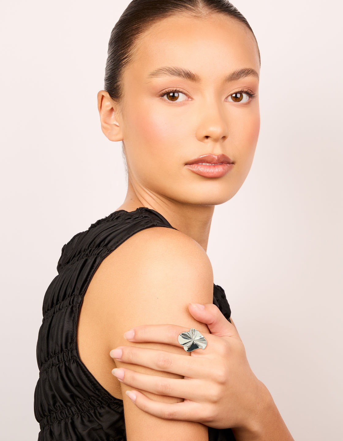 This silver plated organic fan ring in a statement style on finger view