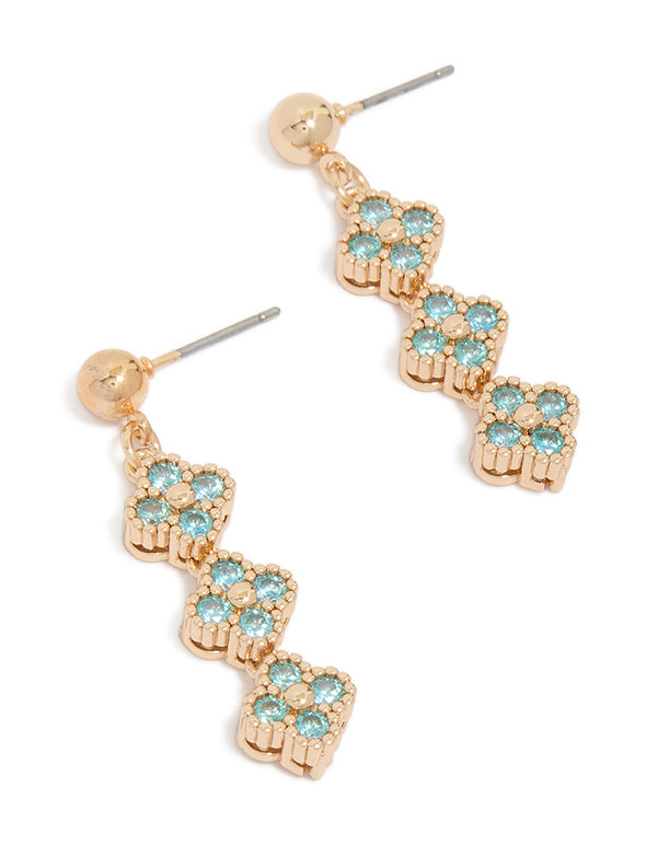 Showcasing drop earrings in gold with floral design featuring cubic zirconia and turquoise accents front view