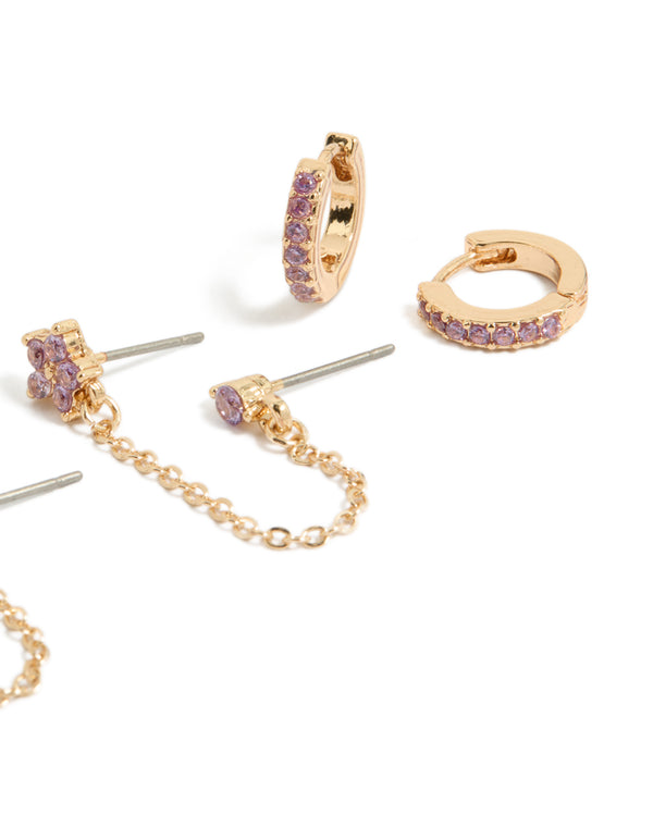 Highlighting dainty cubic zirconia chain flower and huggie earrings pack with crystal in gold and stud closure close up view