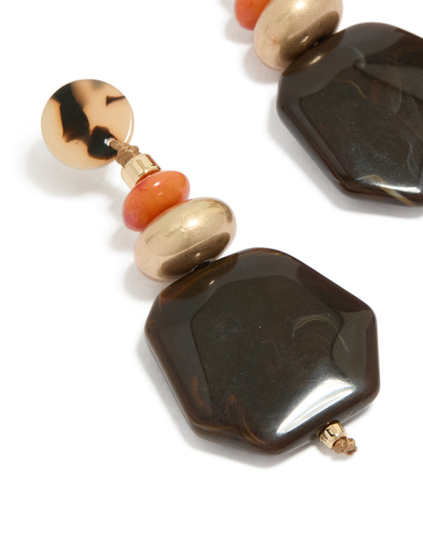 Beautifully crafted gold acrylic stone drop threader earrings with beads stones in statement style close up view
