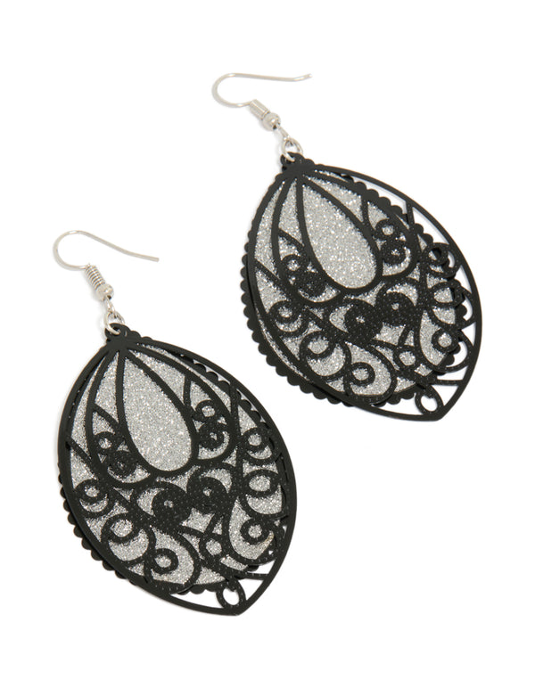Showcasing statement drop earrings featuring lace pattern with glitter accents in black and silver front view
