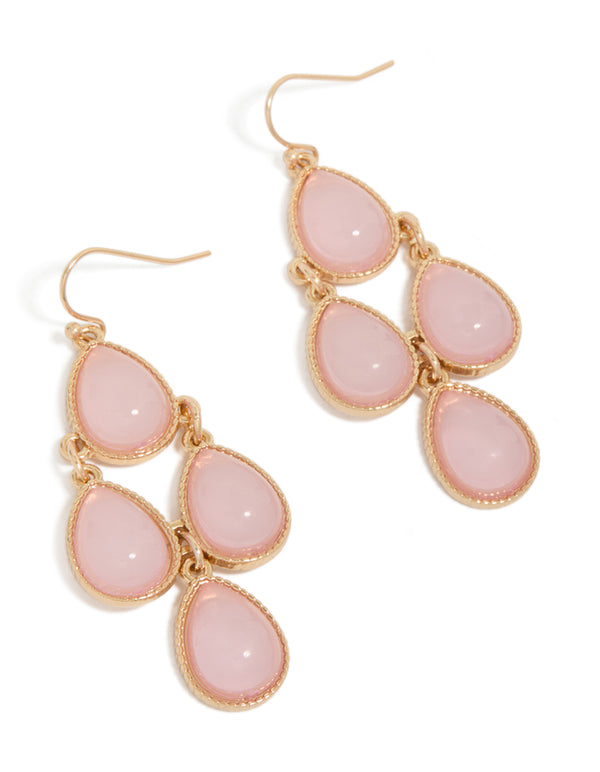 Showcasing teardrop drop earrings in gold with pink stones front view