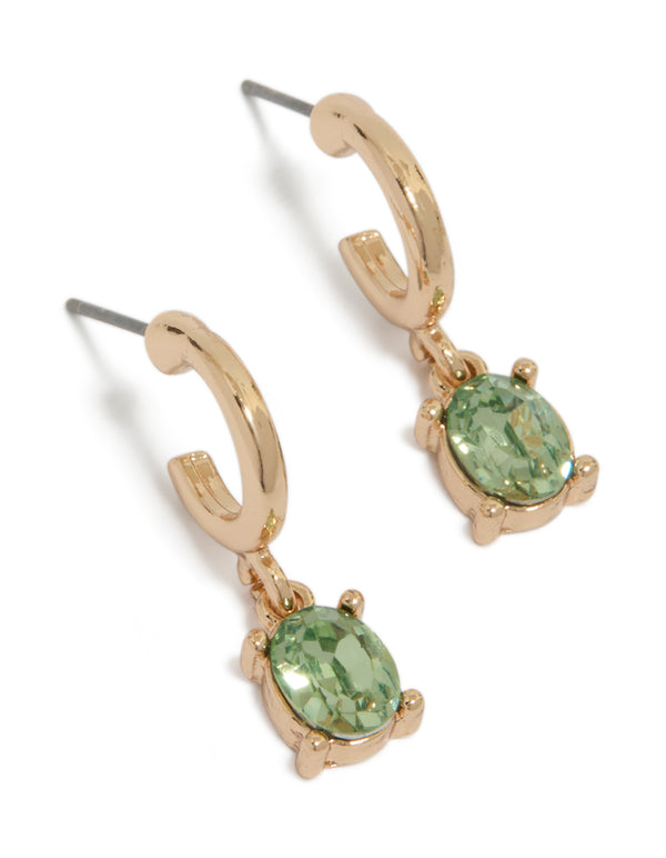 Showcasing gold oval olive green diamante huggie earrings with huggie closure front view