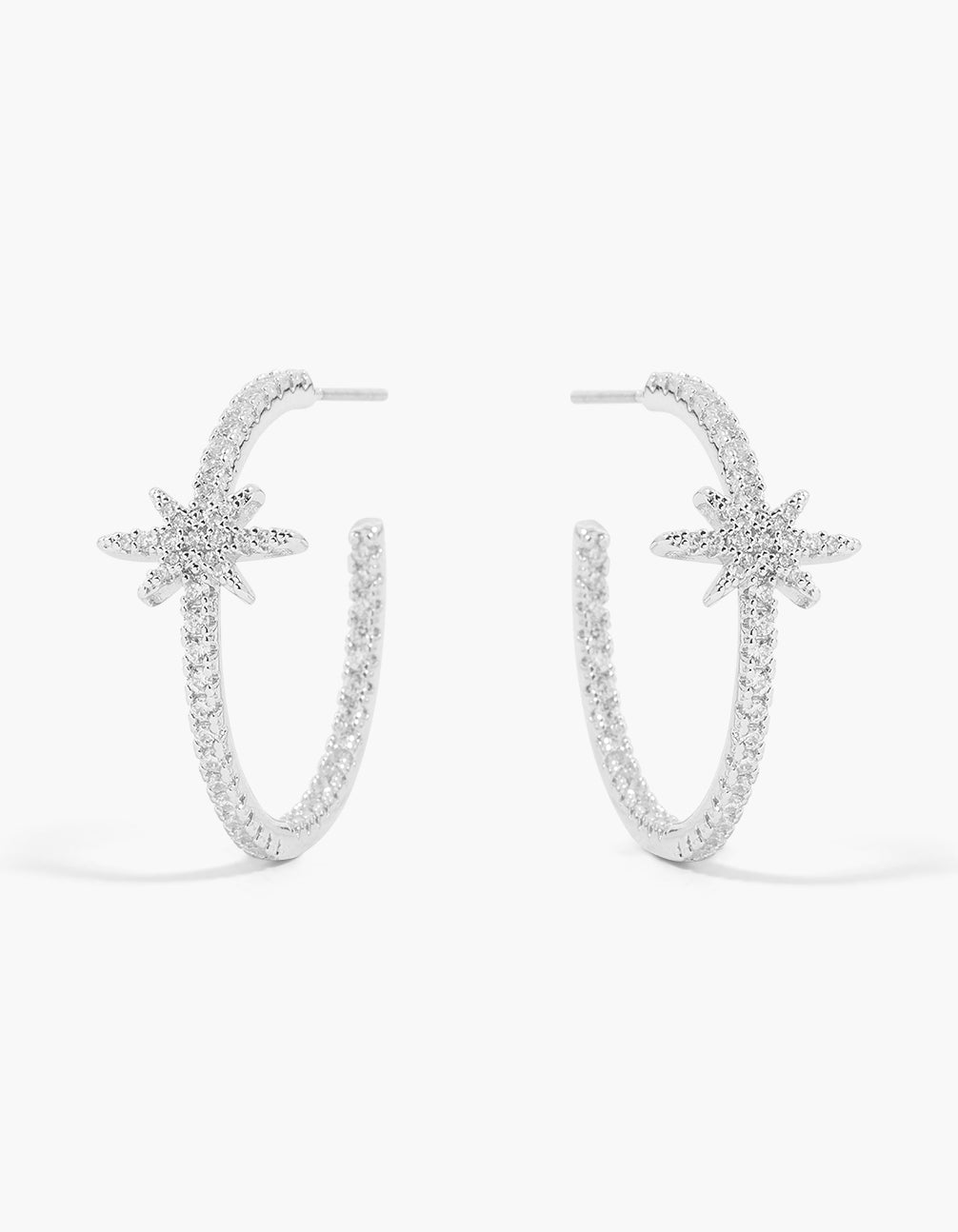 Showcasing large statement hoop earrings featuring celestial star design with pavé cubic zirconia in silver front view
