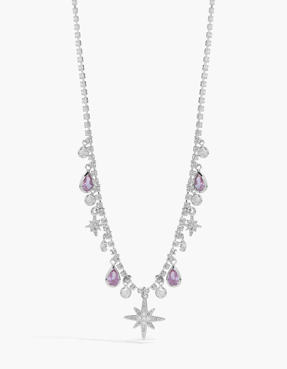 Showcasing a silver lilac cubic zirconia teardrops and celestial star charms necklace with pear shape crystal features close up view