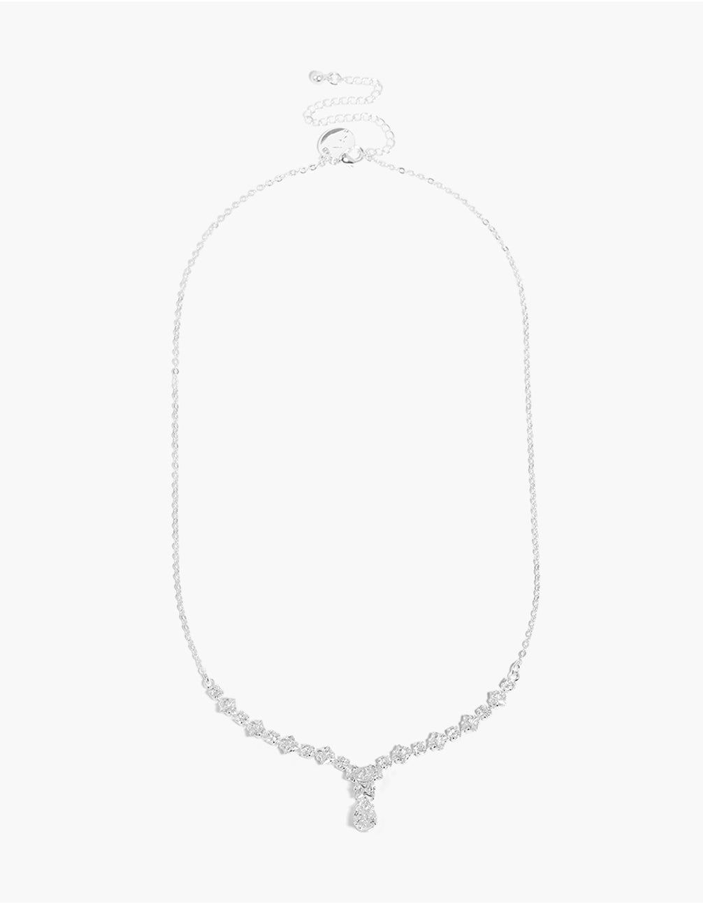 Highlighting a small graduating cubic zirconia Y-necklace in silver plated metal with dainty design and clasp detail front view