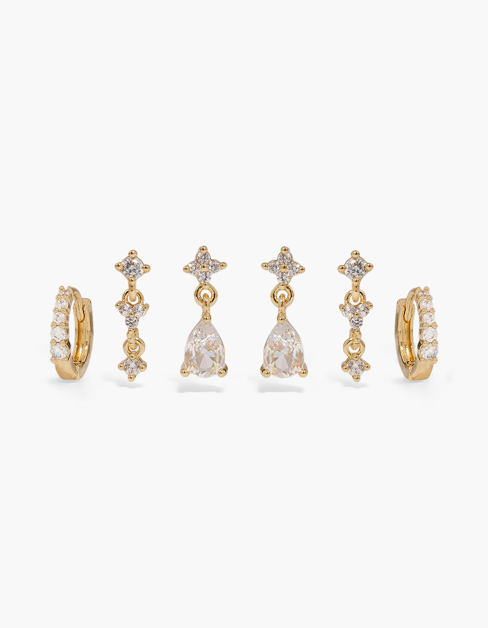 Showcasing a mini charm huggie and drop earrings 3-pack crafted from gold plated metal with cubic zirconia crystal features front view