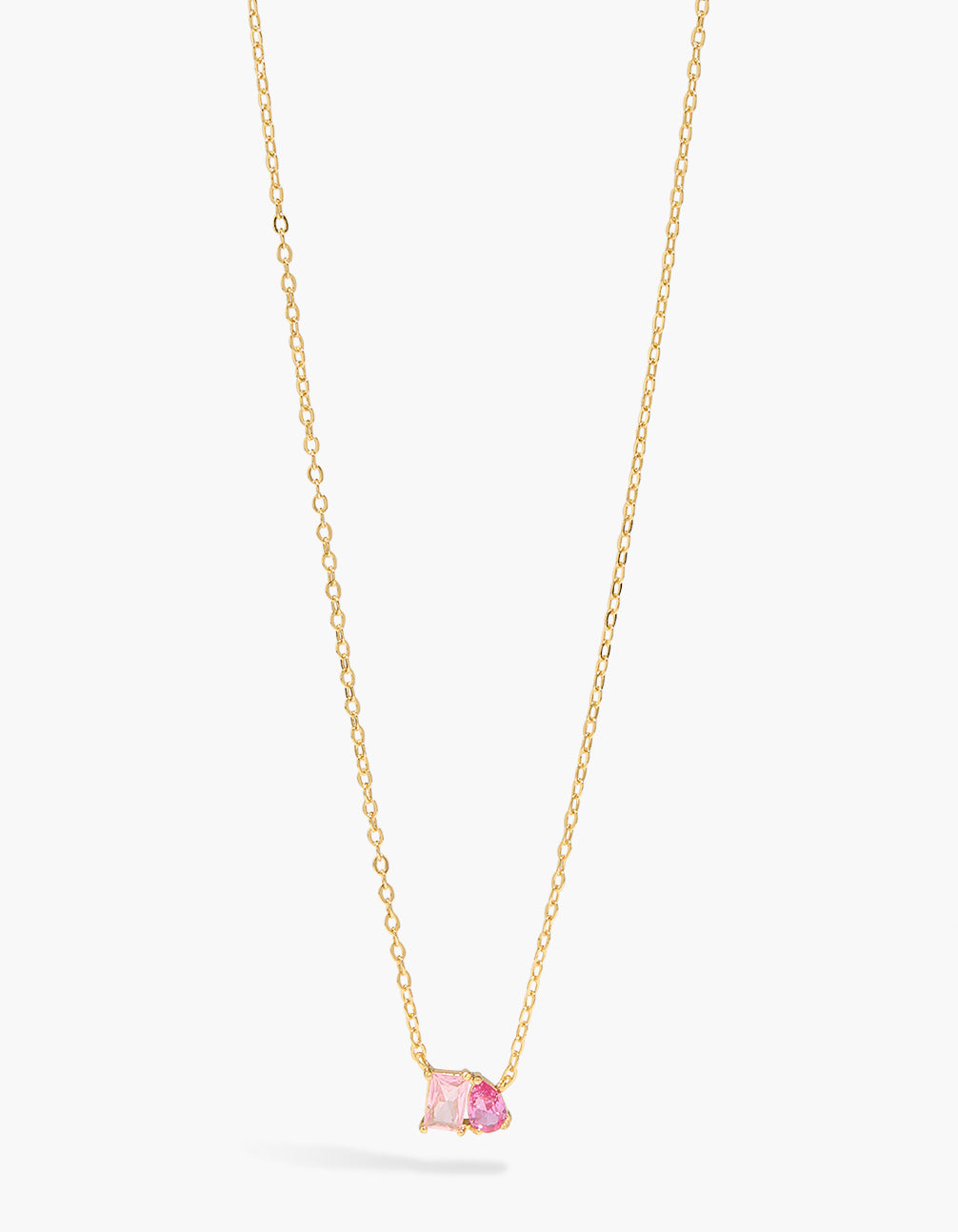 Showcasing a gold plated pink cubic zirconia toi et moi pendant necklace with crystal features close up view