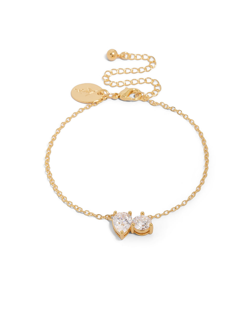 Featuring a gold plated teardrop and circle cubic zirconia bracelet with crystal accents in gold front view