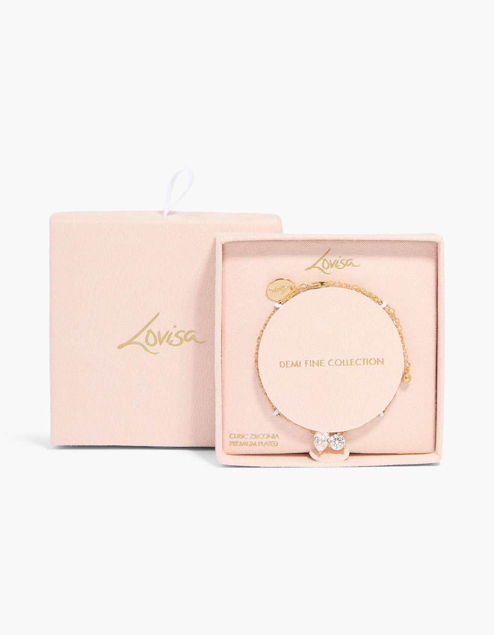 Showcasing a gold plated teardrop and circle cubic zirconia bracelet with crystal accents in gold close up view
