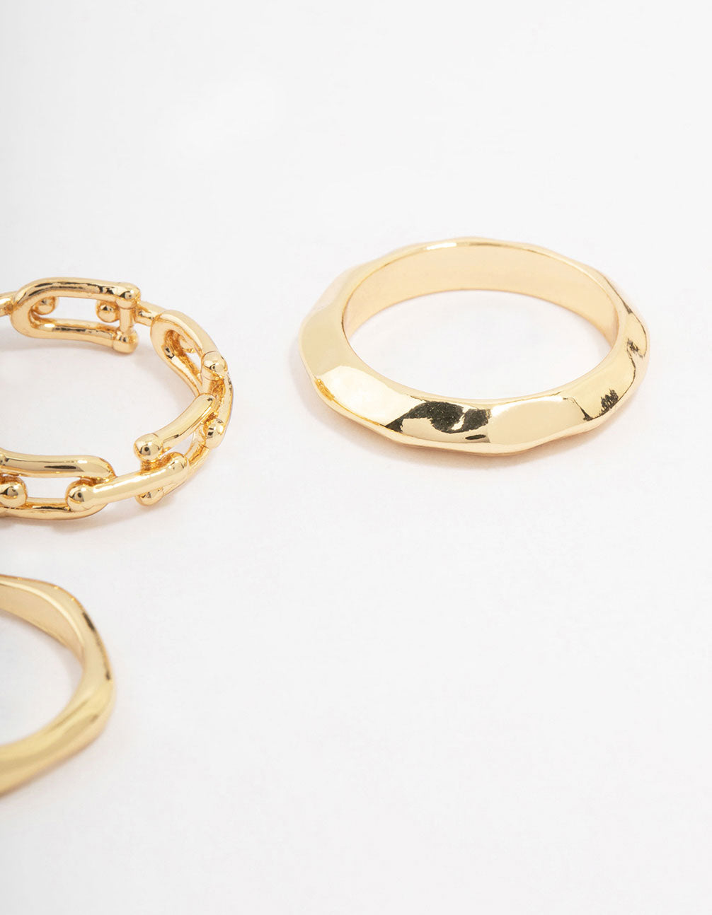 Showcasing gold plated chain link stacking ring 3-pack close up view