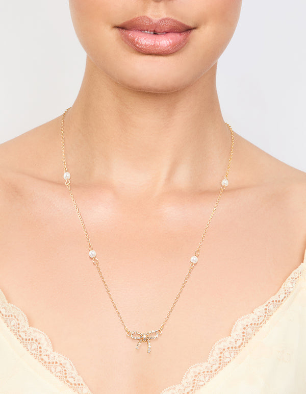 Gold Plated Station Pearl Diamante Bow Pendant Necklace