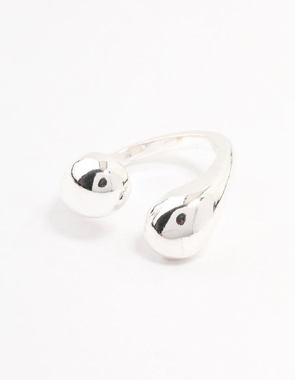 Designed with dual sphere accents, this chunky ring in silver plated metal highlights structural elements side detail view