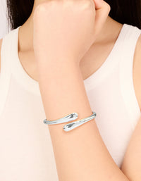 Featuring a silver plated open hinge wrapped bracelet on wrist view - link has visual effect only