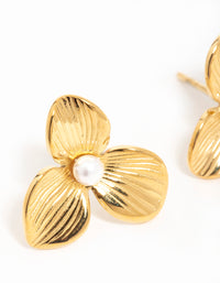 Showcasing waterproof gold plated stainless steel pearl flower stud earrings close up view - link has visual effect only