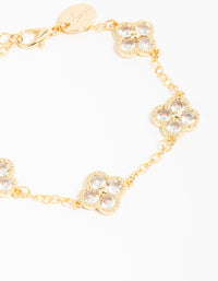 Crafted from gold plated cubic zirconia statement flower bracelet with charm detailing close up view - link has visual effect only