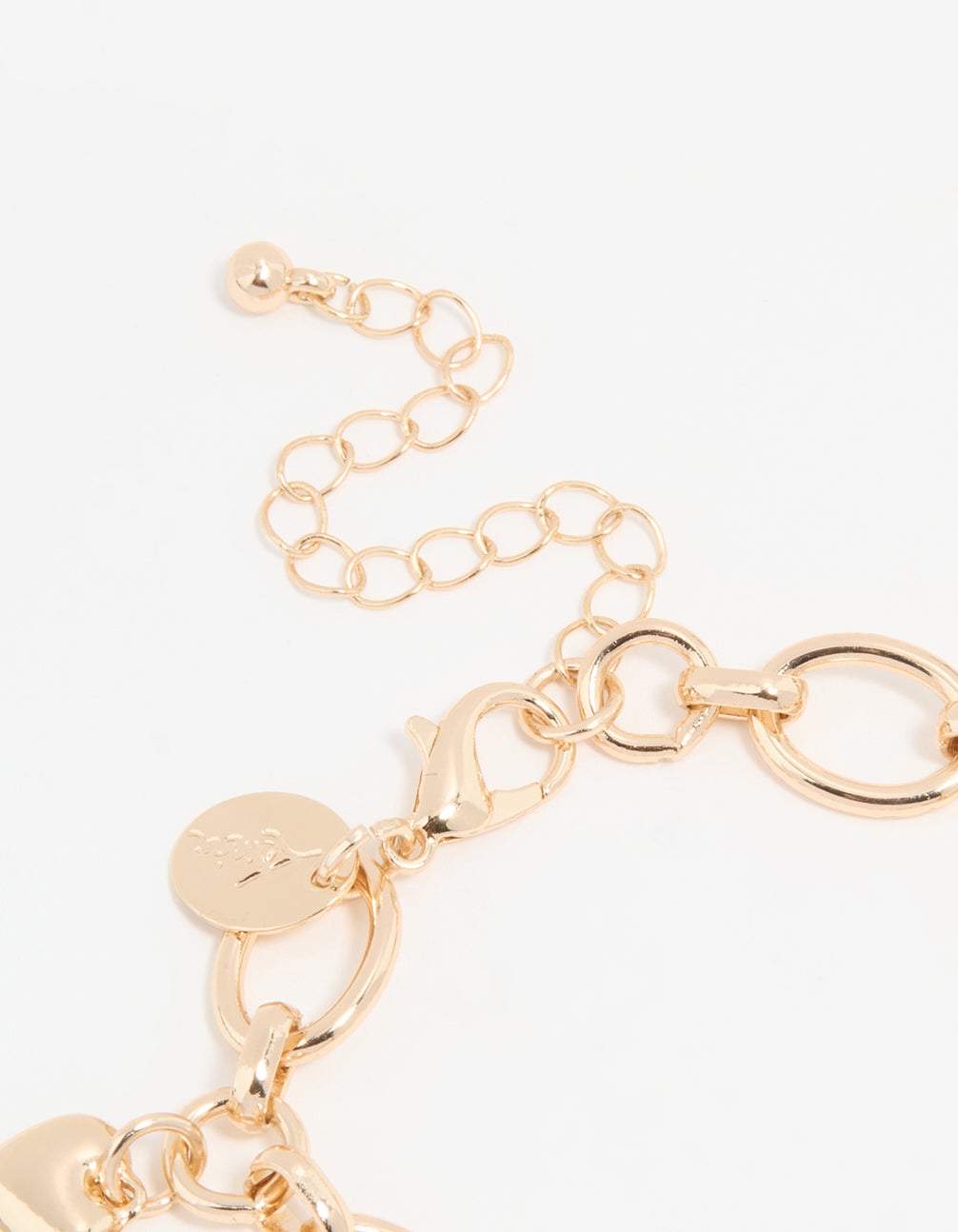 Showcasing a gold pearl star and watch charm bracelet for women featuring bow, heart, celestial details with numbered white round dial, link band, and statement casual styling and analog type closure detail view
