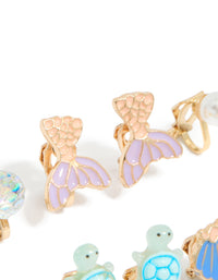 Crafted kids turtle and mermaid clip on earrings in a 5-pack with ocean pearl and shell feature in gold lavender light blue mint cream detail view - link has visual effect only