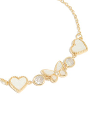 Presenting gold plated cubic zirconia butterfly and heart toggle bracelet close up view - link has visual effect only
