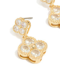 Elegant gold plated cubic zirconia small and medium flower earrings featuring a dainty clear stone design in close up view - link has visual effect only