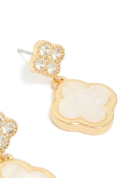 Elegant gold plated cubic zirconia drop earrings with double floral motif and ivory detailing close up view - link has visual effect only