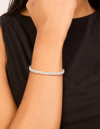 Showcasing a waterproof stainless steel diamante Roman numeral hinge bangle in silver with clear stones on wrist view - link has visual effect only
