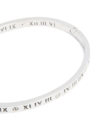 Featuring waterproof stainless steel construction, this diamante Roman numeral hinge bangle displays silver and clear stones detailing close up view - link has visual effect only