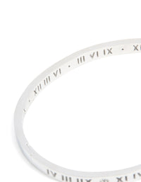 Featuring waterproof stainless steel construction, this diamante Roman numeral hinge bangle displays silver and clear stones detailing close up view - link has visual effect only