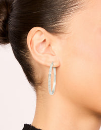 Beautifully crafted waterproof stainless steel diamante hoop earrings in 45 MM with silver and clear tones on ear view - link has visual effect only