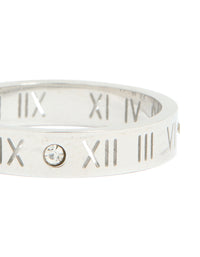 Highlighting waterproof stainless steel construction with engraved Roman numerals and cubic zirconia stones in silver and clear stone close up view - link has visual effect only