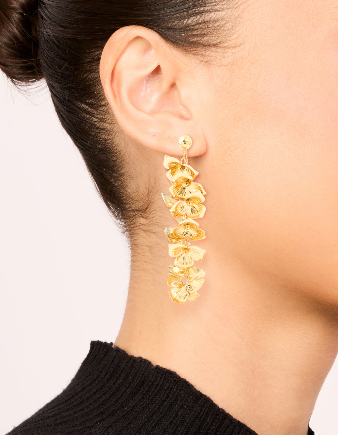 Presenting waterproof gold plated stainless steel flower cascading drop earrings on ear view