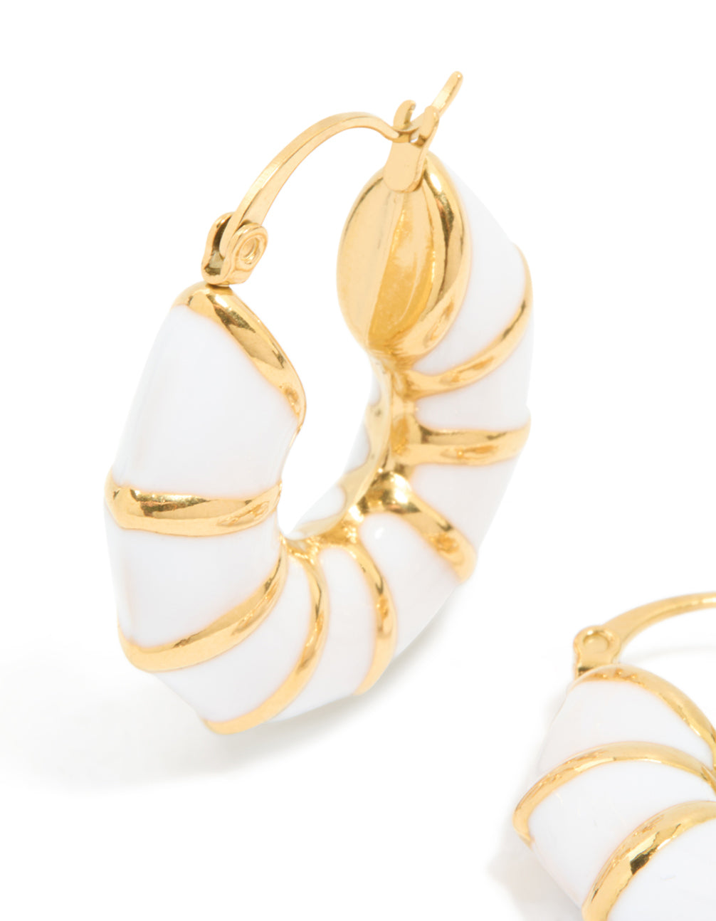 Crafted with precision, waterproof gold plated stainless steel bamboo white enamel huggie earrings in close up view