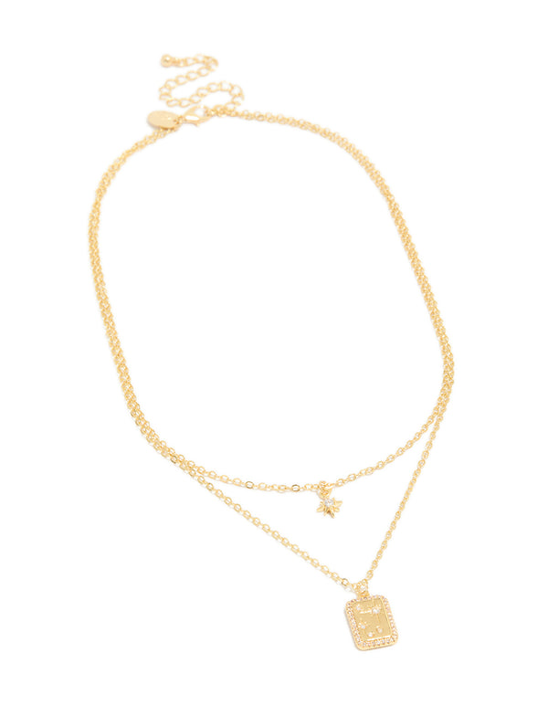 Featuring a gold plated cubic zirconia celestial and rectangle cluster layered necklace front view