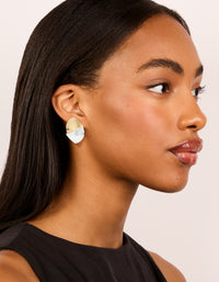 Featuring mixed metal plated wavy ribbed stud earrings in gold and silver on model view - link has visual effect only