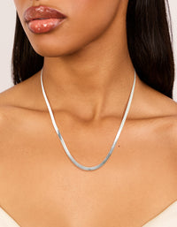 Featuring a waterproof stainless steel fine flat snake chain necklace in silver on neck view - link has visual effect only
