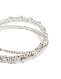 Highlighting silver diamante crossed circle wrist cuff,statement bangle in close up view - link has visual effect only
