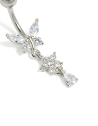 Highlighting surgical steel cubic zirconia butterfly and flower belly bar with balls, floral charm, and bar in silver close up view - link has visual effect only