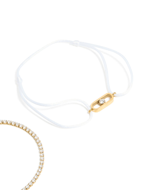Beautiful waterproof gold plated stainless steel bracelet set with oval cut cubic zirconia tennis and white cord close up view