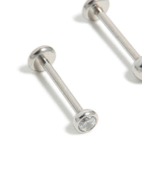 Designed with titanium bezel cubic zirconia threadless flat back nose studs featuring ball accents in silver close up view - link has visual effect only