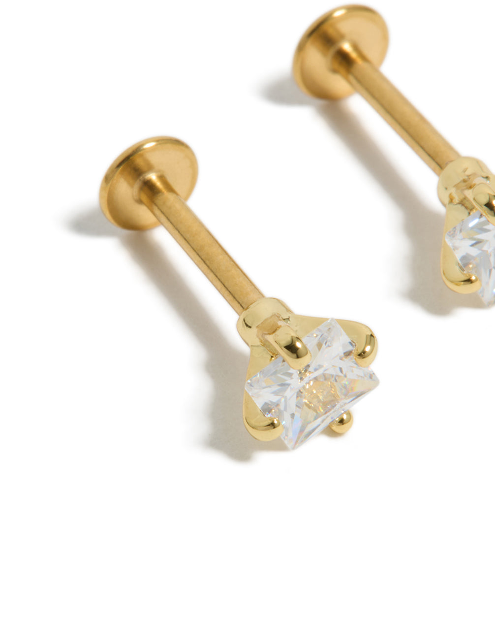 Crafted from gold plated surgical steel featuring cubic zirconia with flat back clear stone stud close up view