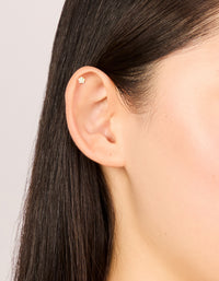 Showcasing studs with celestial star, cubic zirconia and flat back in gold plated surgical steel on ear view - link has visual effect only