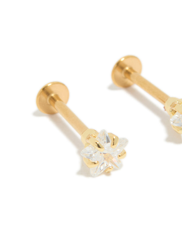 Highlighting celestial star with cubic zirconia, these flat back stud earrings with gold plated surgical steel close up view