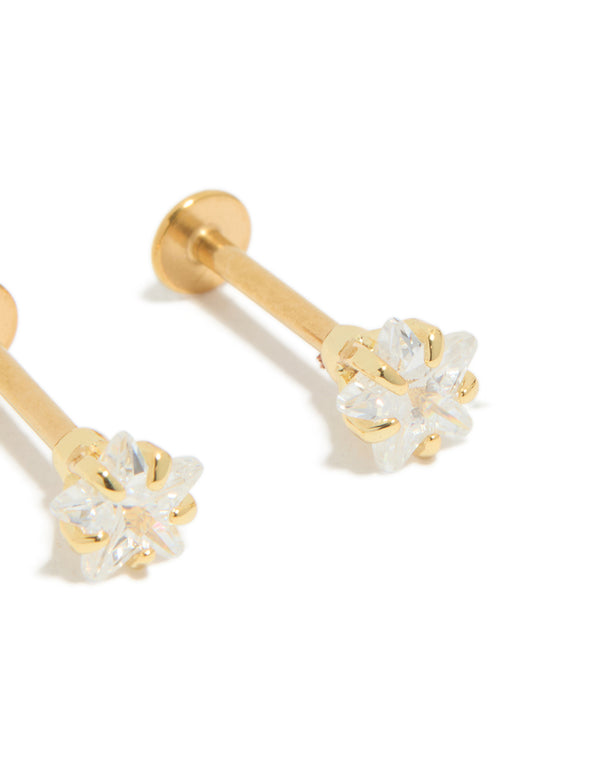Presenting studs with celestial star, cubic zirconia and flat back in gold plated surgical steel close up view