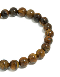 Highlighting mens waterproof stainless steel tiger's eye beaded bracelet in close up view - link has visual effect only