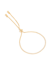 Featuring a dainty gold plated cubic zirconia mini tennis toggle bracelet front view - link has visual effect only